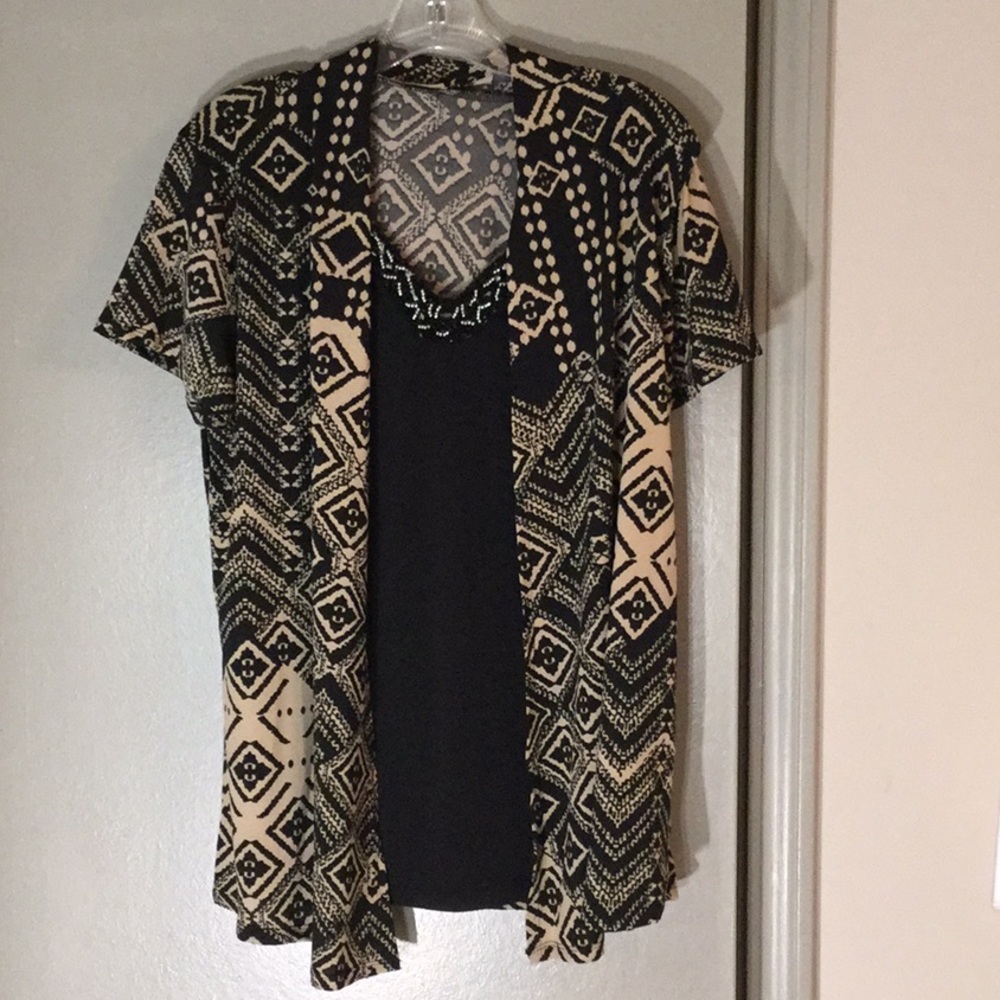 Lavish brand designer Lady’s top; Size: Large